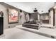 Spacious home theater offering comfortable seating, a projector screen, and a full cinematic experience at 7929 N 55Th St, Paradise Valley, AZ 85253