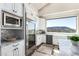 Modern kitchen with stainless appliances, marble counters, and mountain views at 7929 N 55Th St, Paradise Valley, AZ 85253