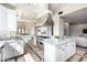 Spacious kitchen features white cabinets, a stainless steel island range, marble countertops, and tile floors at 7929 N 55Th St, Paradise Valley, AZ 85253