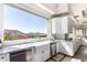 Bright kitchen boasts a farmhouse sink, white cabinets, stainless steel appliances, and a marble countertop at 7929 N 55Th St, Paradise Valley, AZ 85253