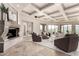 Bright living room with fireplace and views of the surrounding mountain landscape at 7929 N 55Th St, Paradise Valley, AZ 85253