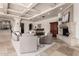 Bright living room showcases a fireplace, wet bar, and coffered ceilings at 7929 N 55Th St, Paradise Valley, AZ 85253