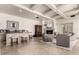 Elegant living room boasts a fireplace, wet bar, coffered ceilings and neutral tones at 7929 N 55Th St, Paradise Valley, AZ 85253