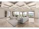 Bright living room features mountain views, elegant seating, marble floors, and sliding doors for seamless indoor/outdoor living at 7929 N 55Th St, Paradise Valley, AZ 85253