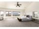 Spacious main bedroom with scenic views from the large windows and neutral decor at 7929 N 55Th St, Paradise Valley, AZ 85253