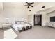 Expansive main bedroom features neutral decor, large windows, and access to ensuite bathroom at 7929 N 55Th St, Paradise Valley, AZ 85253