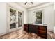 Office area features a large wooden desk and natural light at 7929 N 55Th St, Paradise Valley, AZ 85253