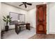Bright office with a dark wood desk, neutral decor, and a large window for natural light at 7929 N 55Th St, Paradise Valley, AZ 85253