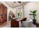 Beautiful office area complete with a custom desk and a wine fridge at 7929 N 55Th St, Paradise Valley, AZ 85253