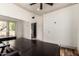 The office features a minimalist design with wooden floors, large desks, and plenty of natural light at 7929 N 55Th St, Paradise Valley, AZ 85253