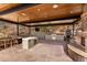 Outdoor kitchen and entertainment area with stone fireplace, grill, and views at 7929 N 55Th St, Paradise Valley, AZ 85253