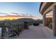 Spacious stone patio features iron railing with city views, sunset views, and an outdoor seating area at 7929 N 55Th St, Paradise Valley, AZ 85253