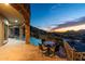 Covered deck area with view of pool and lounge chairs overlooks city lights at 7929 N 55Th St, Paradise Valley, AZ 85253