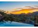 Panoramic view from a desert home with a beautiful sunset over the mountains and city at 7929 N 55Th St, Paradise Valley, AZ 85253