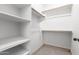 Organized walk-in closet with white shelving and ample hanging space for efficient storage at 7929 N 55Th St, Paradise Valley, AZ 85253