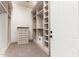 Functional walk-in closet offering plenty of storage, shelving, and a secure safe at 7929 N 55Th St, Paradise Valley, AZ 85253