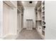Long walk-in closet with built-in shelving, drawers, and a secure safe at 7929 N 55Th St, Paradise Valley, AZ 85253