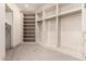 Empty walk-in closet with custom shelving and built-in organization units at 7929 N 55Th St, Paradise Valley, AZ 85253