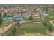Community aerial view showcasing golf course, tennis courts, clubhouse, and scenic ponds at 9447 W Tonto Ln, Peoria, AZ 85382