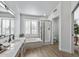 Spa-like bathroom with double sinks, a large tub, and a separate shower at 9447 W Tonto Ln, Peoria, AZ 85382