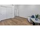 Spacious bedroom with double doors and wood flooring at 9447 W Tonto Ln, Peoria, AZ 85382