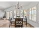Bright dining area with wood table and chairs, and plantation shutters at 9447 W Tonto Ln, Peoria, AZ 85382