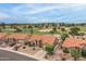 Inviting front exterior with desert landscaping and lush golf course views and three-car garages at 9447 W Tonto Ln, Peoria, AZ 85382