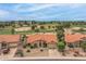 Inviting single-story home with terra cotta roof and desert landscaping, backing onto a golf course at 9447 W Tonto Ln, Peoria, AZ 85382