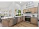 Updated kitchen with light cabinets, stainless steel appliances and island at 9447 W Tonto Ln, Peoria, AZ 85382