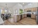 Updated kitchen with stainless steel appliances and an island at 9447 W Tonto Ln, Peoria, AZ 85382