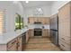 Modern kitchen with stainless steel appliances and white quartz counters at 9447 W Tonto Ln, Peoria, AZ 85382