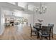 Open living area with hardwood floors and views to kitchen and dining areas at 9447 W Tonto Ln, Peoria, AZ 85382