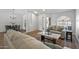 Living room with light-colored couch, coffee table, and entryway at 9447 W Tonto Ln, Peoria, AZ 85382