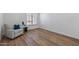 Bright and airy office with wood floors and a comfortable recliner at 9447 W Tonto Ln, Peoria, AZ 85382