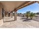 Covered patio with flagstone flooring and golf course view at 9447 W Tonto Ln, Peoria, AZ 85382