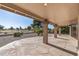 Covered patio with flagstone flooring and golf course view at 9447 W Tonto Ln, Peoria, AZ 85382