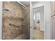 Walk-in shower with glass door and tile surround at 9447 W Tonto Ln, Peoria, AZ 85382