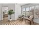 Cozy sitting area with two armchairs and a view to the backyard at 9447 W Tonto Ln, Peoria, AZ 85382