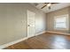 Bedroom featuring hardwood floors, ceiling fan, and window with blinds at 1014 S 2Nd St, Phoenix, AZ 85004