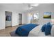 Bedroom with a bed, closet, and balcony access at 12221 W Bell Rd # 243, Surprise, AZ 85378