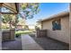 Brick pathway leading to the side entrance with a cactus art piece at 13051 W Blue Sky Dr, Sun City West, AZ 85375