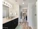 Modern bathroom with double vanity, walk-in shower, and large closet at 1344 W Inca Dr, Coolidge, AZ 85128