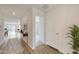 Bright and spacious entryway with wood-look flooring and view to living area at 1344 W Inca Dr, Coolidge, AZ 85128