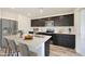 Modern kitchen island with white quartz countertop and seating at 1344 W Inca Dr, Coolidge, AZ 85128