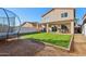 Backyard with covered patio and trampoline at 1409 E Harvest Rd, San Tan Valley, AZ 85140