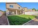 Home's backyard with covered patio at 1409 E Harvest Rd, San Tan Valley, AZ 85140