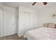 Cozy bedroom featuring a queen bed and ample closet space at 1409 E Harvest Rd, San Tan Valley, AZ 85140