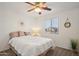Spacious bedroom with a queen bed and neutral decor at 1409 E Harvest Rd, San Tan Valley, AZ 85140