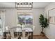 Dining area with four chairs and a large window at 1409 E Harvest Rd, San Tan Valley, AZ 85140