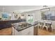 Open concept kitchen with island, living room view, and breakfast nook at 1409 E Harvest Rd, San Tan Valley, AZ 85140